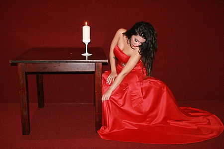 woman wears red strapless dress thumbnail