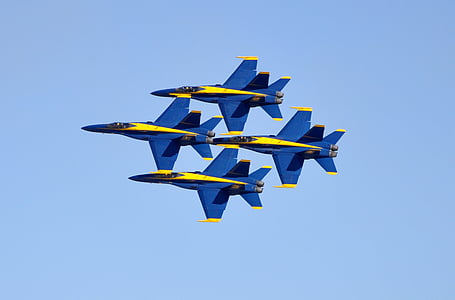four gray and white fighting jet under blue sky during daytime thumbnail