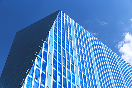 Angled building on a sunny blue day in the city thumbnail