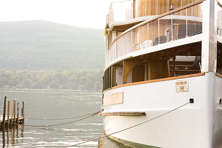 white and brown ship on body of water thumbnail