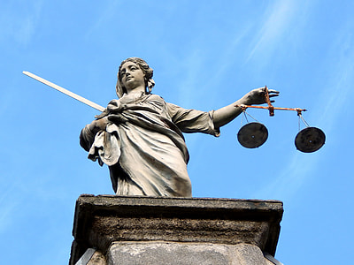 photography of statue of a woman holding scale thumbnail