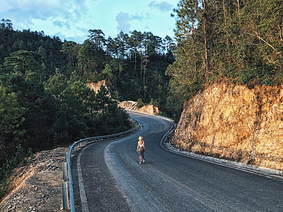 woman standing on middle of road thumbnail