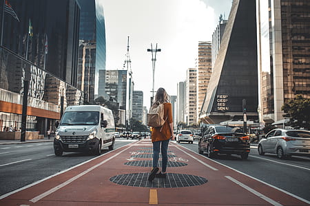 woman carrying bag at the middle of the road thumbnail