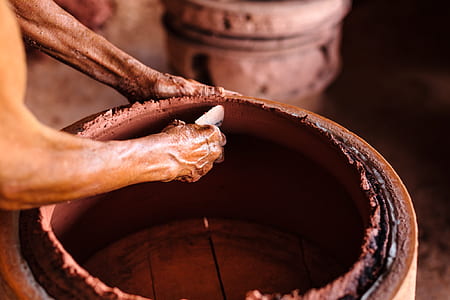 person making clay pot thumbnail