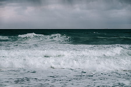 landscape photo of sea waves under clouds thumbnail