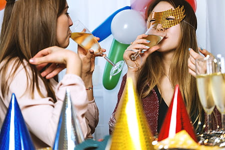 Two young girls celebrate. Happy New Year thumbnail