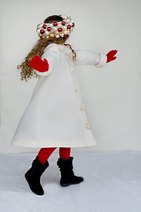 girl wearing white coat standing near white wall thumbnail