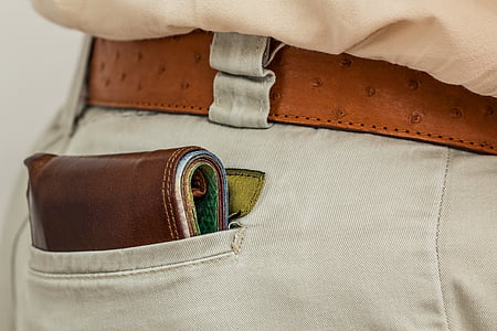 brown leather wallet in gray bottoms pocket thumbnail