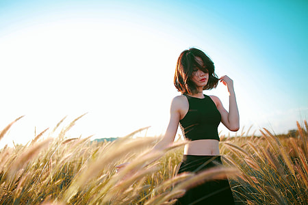 Pretty Girl in black tank top in a field thumbnail