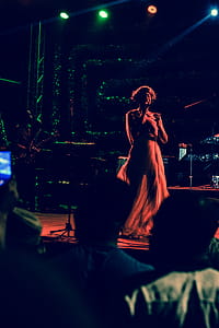 Woman Singing on Stage thumbnail