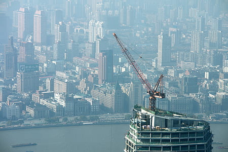 bird's-eye view red metal crane on gray building thumbnail