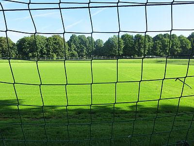 black goal net on green football field close-up photography at daytime thumbnail