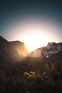 silhouette photography of waterfalls, mountain, and trees thumbnail