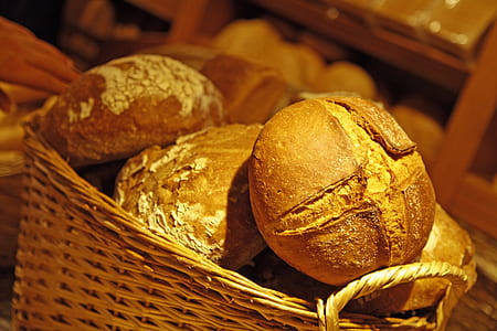 baked bread in brown wicker basket thumbnail