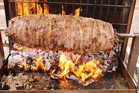grilled meat in front of fence thumbnail