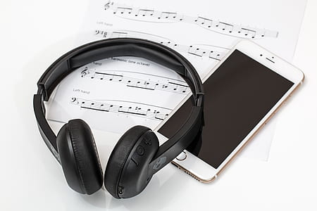 black wireless headphone on gold iPhone 6 thumbnail