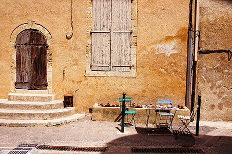 table and chairs beside wall thumbnail