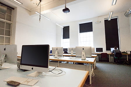 person using computer at the side of the room thumbnail