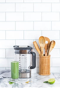 blender pitcher near wooden spoons thumbnail