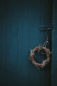 brown twigs wreath hanging on door lever thumbnail
