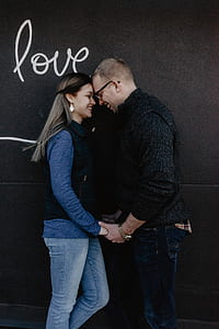 woman and man smiling facing each other thumbnail