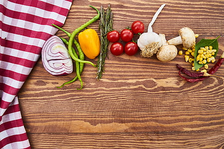 assorted vegetables line-up on brown wooden surface thumbnail