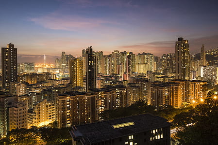 brown city buildings with during sunrise thumbnail