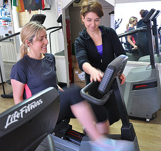 woman sitting on recumbent stationary bike thumbnail