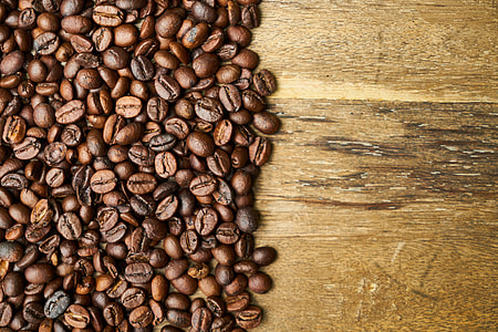 coffee beans on brown wooden surface thumbnail