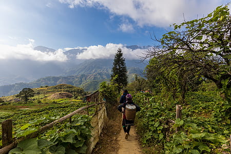woman waking on mountain side thumbnail