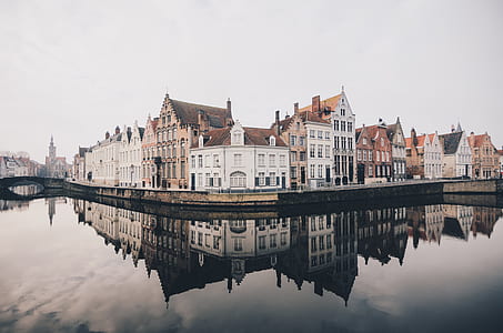 photo of houses and buildings near body of water thumbnail