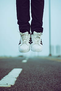 Person in Adidas Sneakers thumbnail
