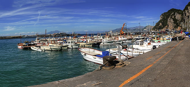white sail boat lot during daytime thumbnail