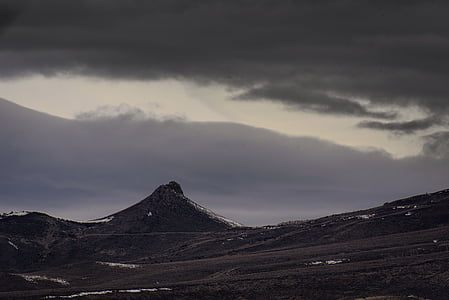 brown field and mountain in distance thumbnail