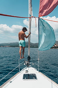 Man Standing on Boat thumbnail