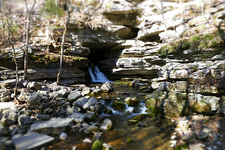 creek under brown cliff thumbnail
