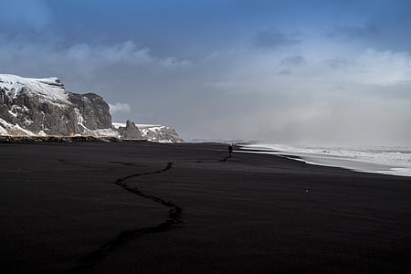 seashore under cloudy sky thumbnail
