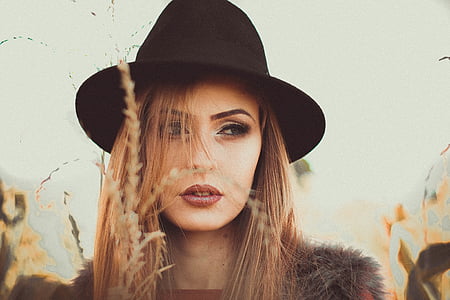 closeup photo of woman wearing black hat thumbnail