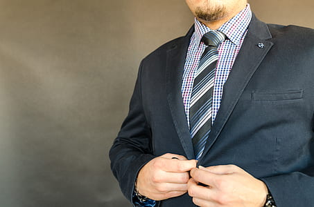 man wearing black notched lapel suit jacket thumbnail