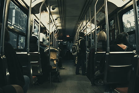 Man in White T Shirt Standing on the Bus thumbnail