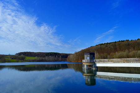 panoramic photography of shed beside boat dock near body of water thumbnail
