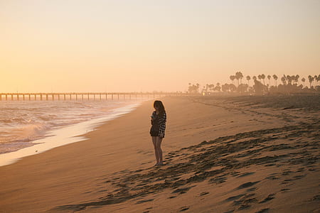 woman standing in seashore thumbnail