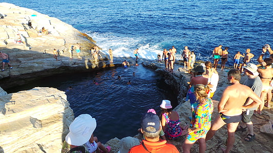 people gathered near the beach during daytime thumbnail