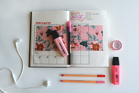 two red and pink highlighters on white surface thumbnail