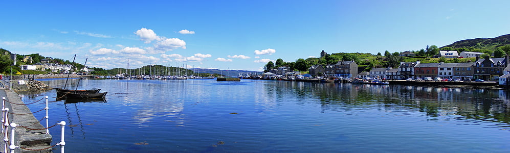 boat on river near buildings during daytime thumbnail