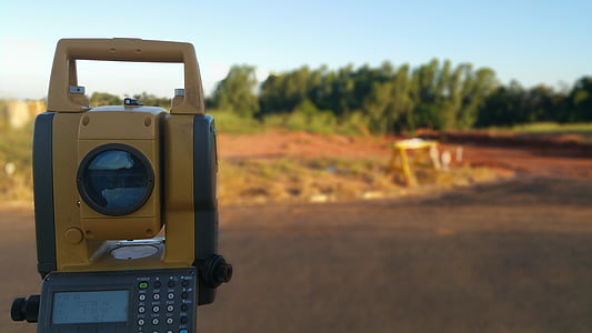 brown and black land survey during daytime shallow focus photography thumbnail