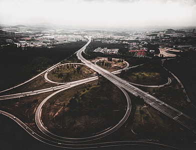 aerial view of spiral roads during daytime thumbnail