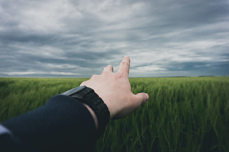 person pointing on gray sky thumbnail