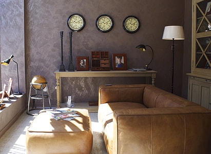 photo of brown leather 2-seat sofa infront on ottoman chair thumbnail