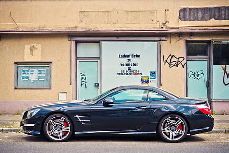 selective focus photography of black coupe thumbnail